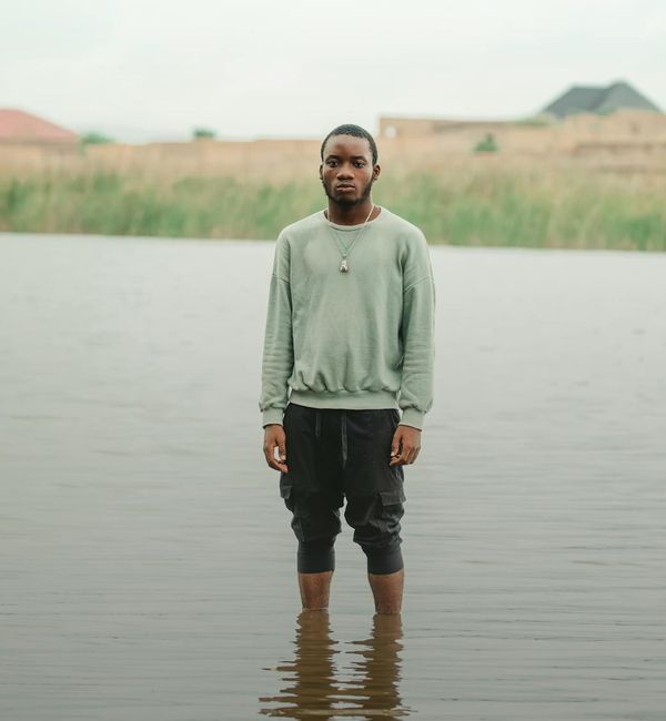 Man meditating in a calm, modern environment.