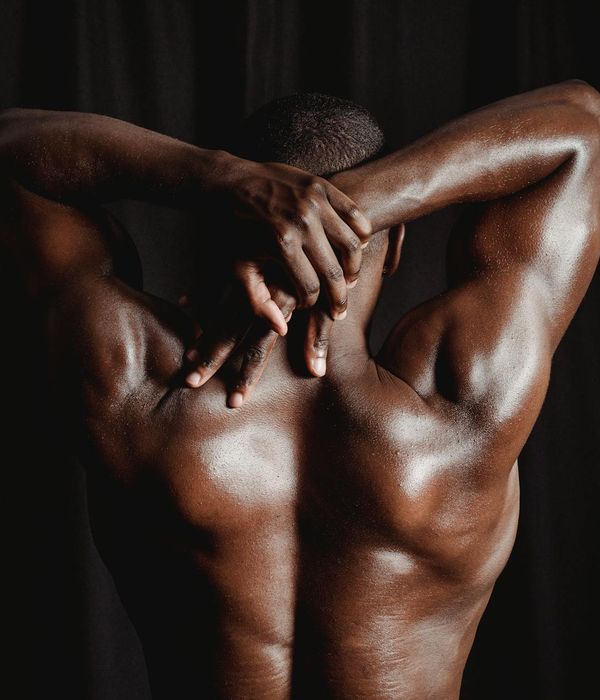 Man performing a complex strength exercise with focus.